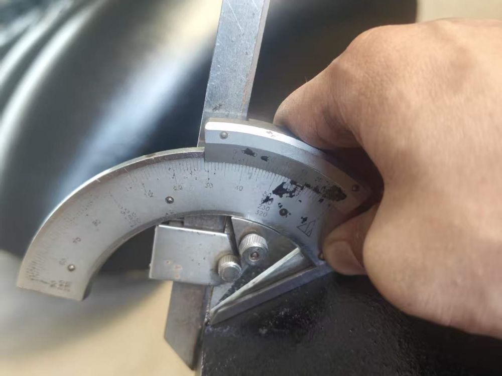 Weld-end bevel angle check with a bevel protractor
